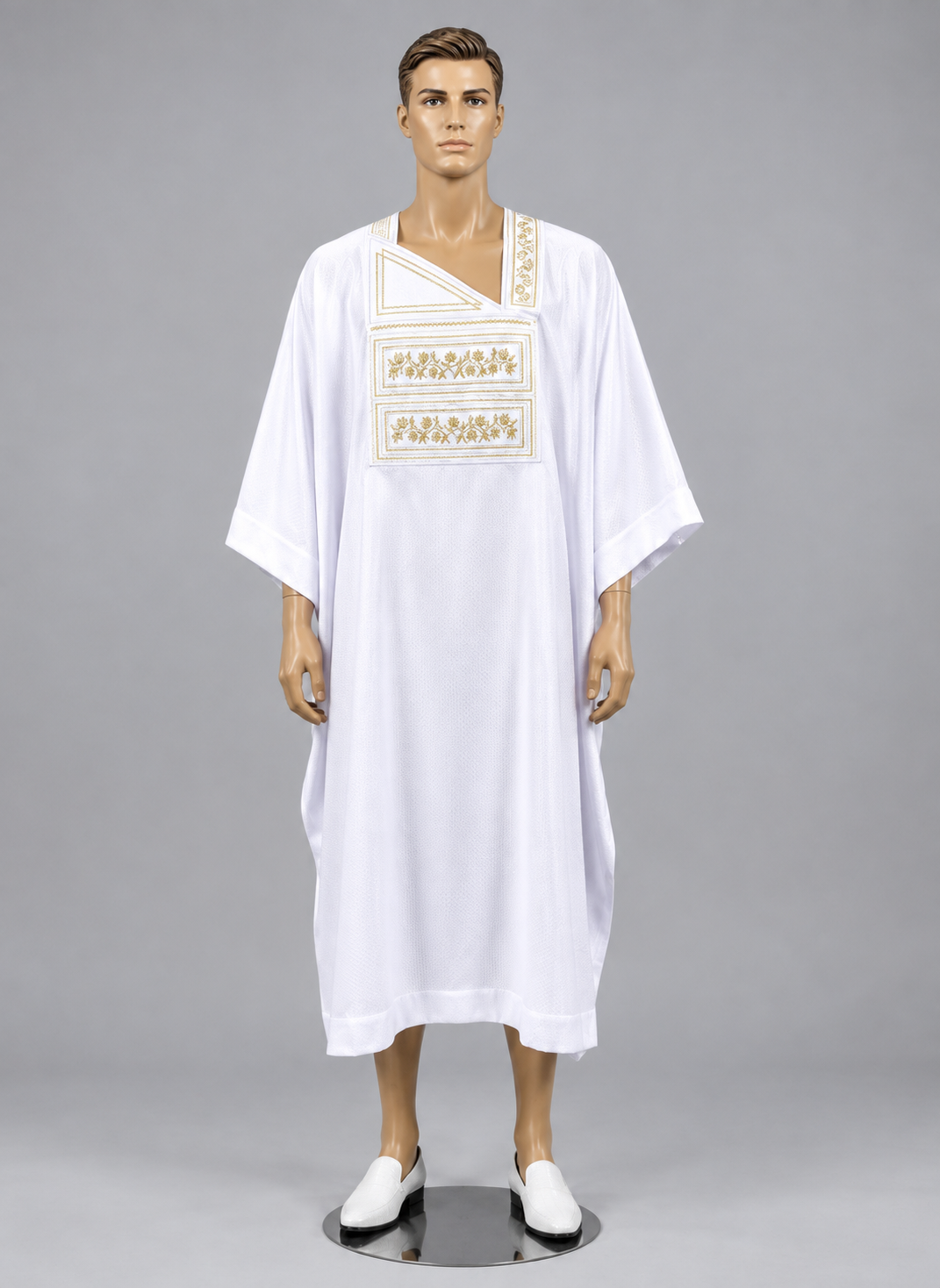  White men's kaftan tunic featuring ornate gold embroidery across the chest.